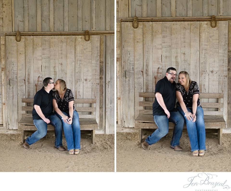 couple kissing in barn