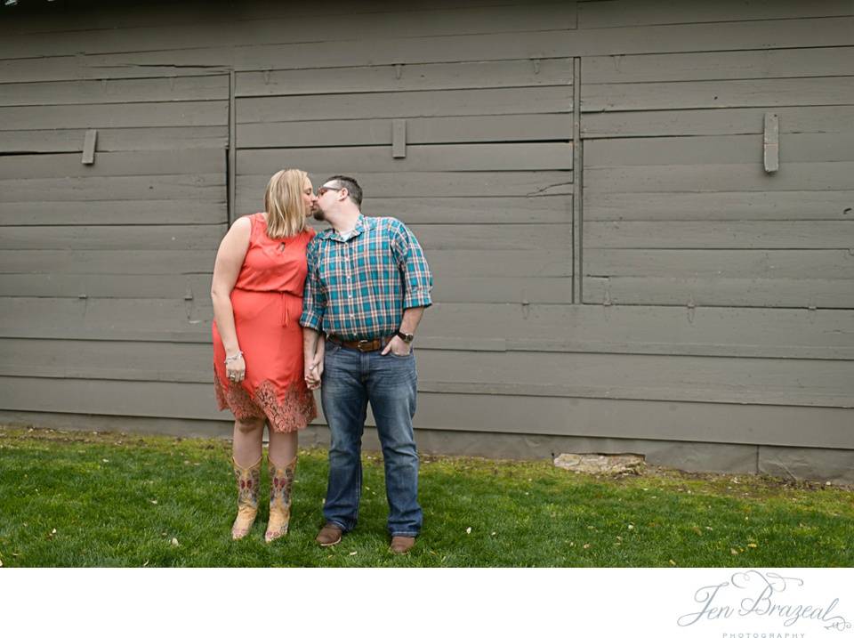 couple kissing in front of Gruene Hall