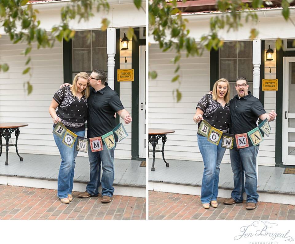 engaged couple holding up new last name