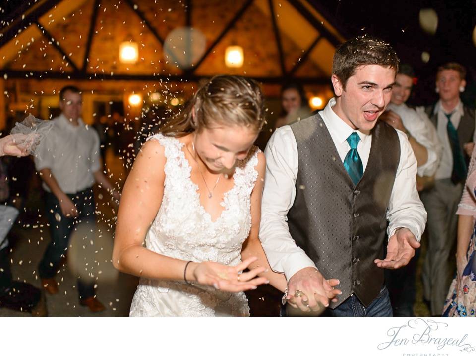 bride and groom leaving wedding with bird seed