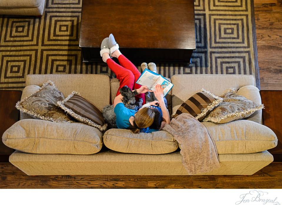 mom reading book to son view from above